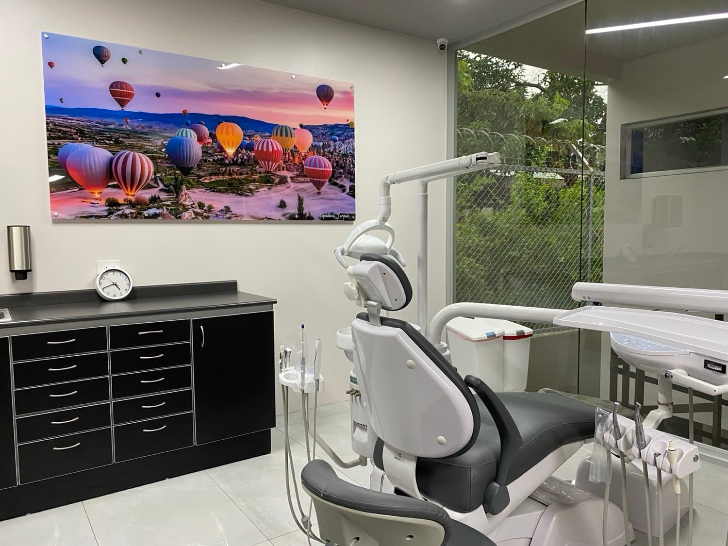Treatment room with Cappadocia hot air balloon wall art and glass window