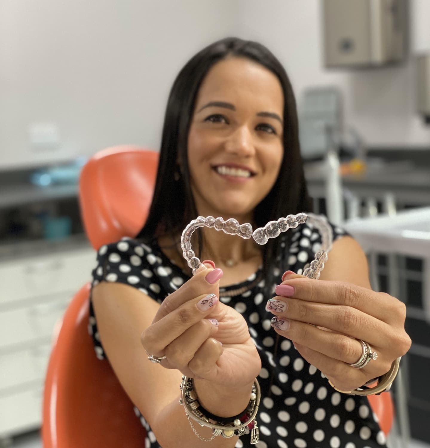 Patient smiling with clear aligners